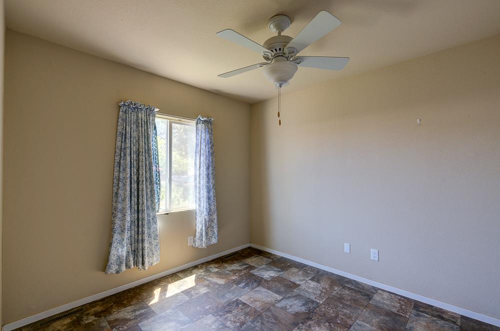 1218 East Cleveland Avenue, Unit 19 Madera, CA 93638 - Photo 14 of 18 a view of an empty room and window