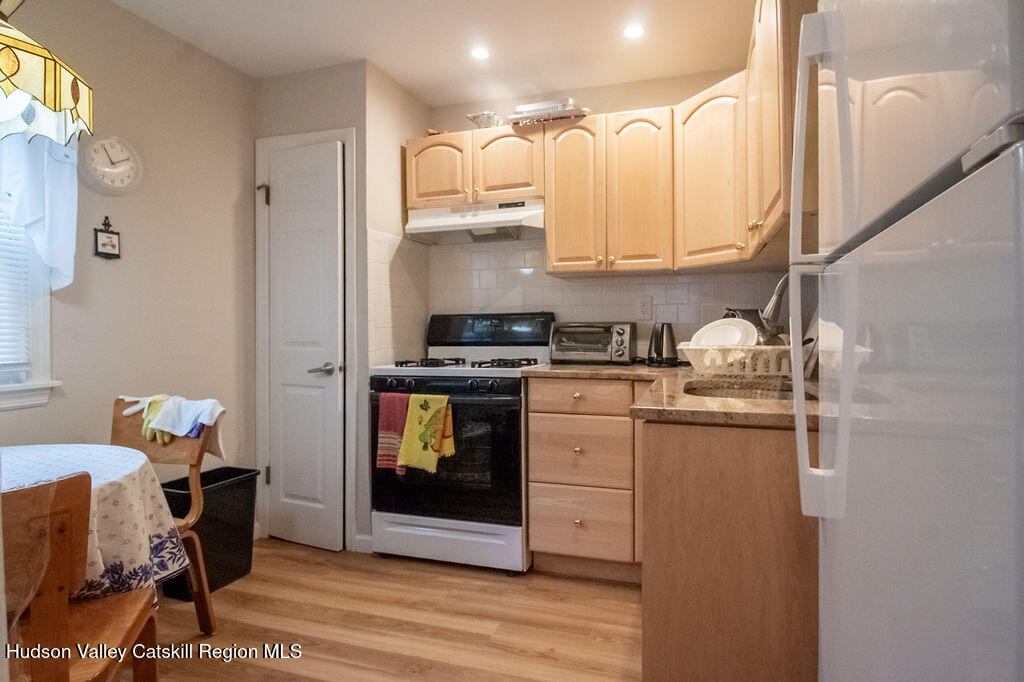 224 Camp Road Ellenville, NY 12428 - Photo 15 of 50 a kitchen with stainless steel appliances granite countertop a sink and cabinets