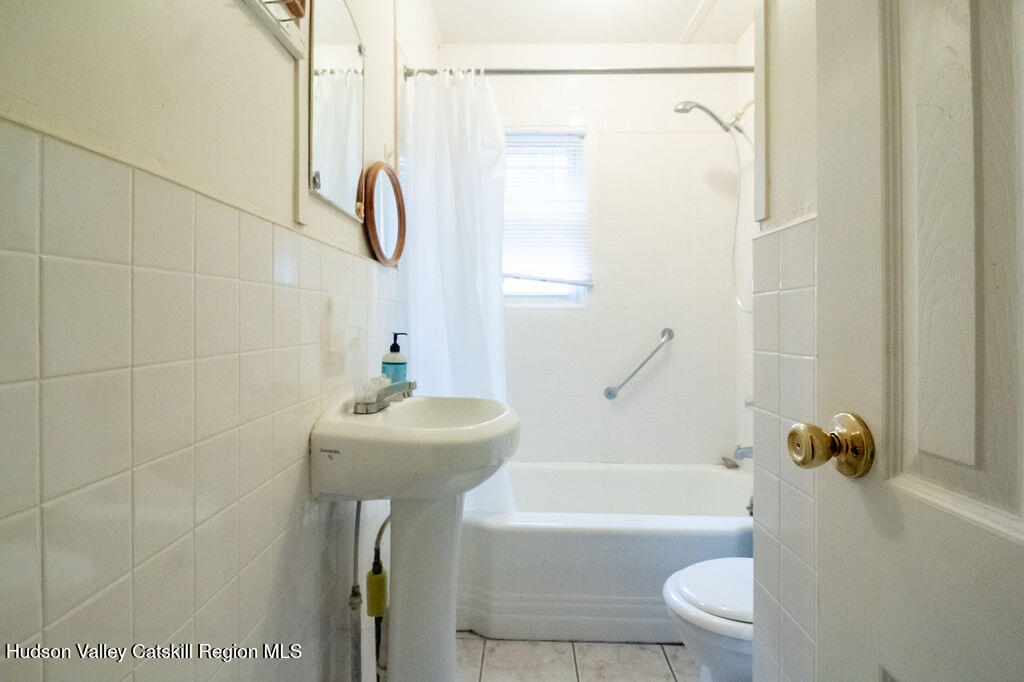 224 Camp Road Ellenville, NY 12428 - Photo 35 of 50 a bathroom with a sink toilet and shower