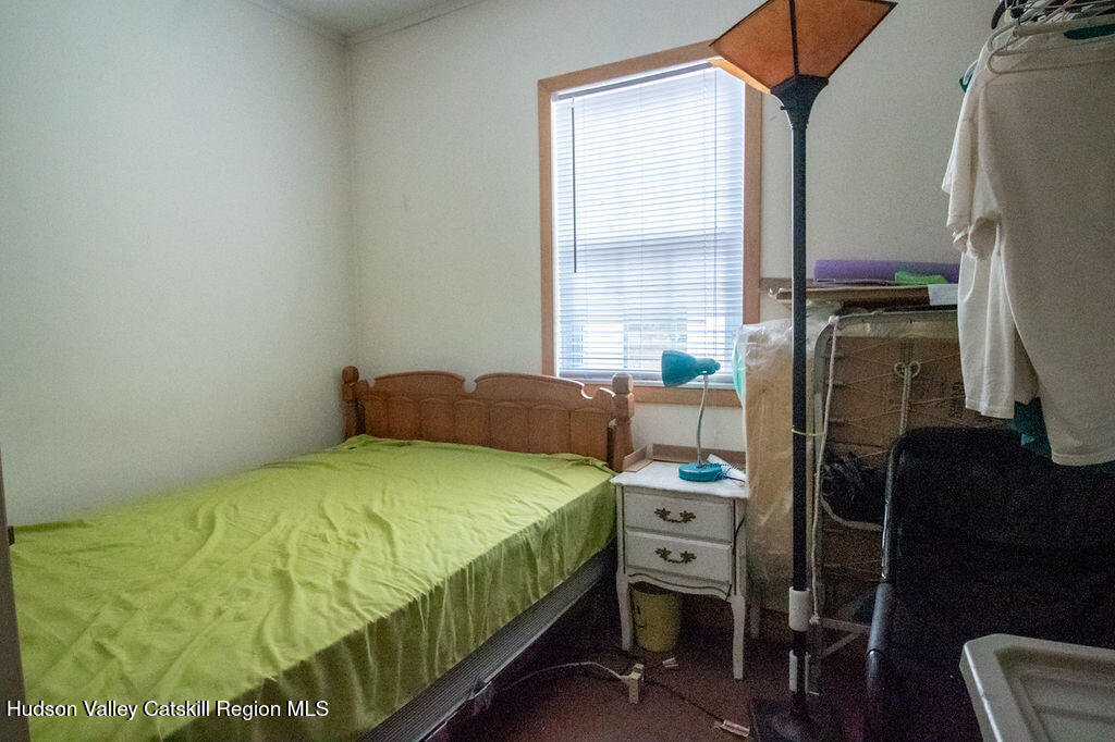 224 Camp Road Ellenville, NY 12428 - Photo 41 of 50 a bedroom with a bed and a tv