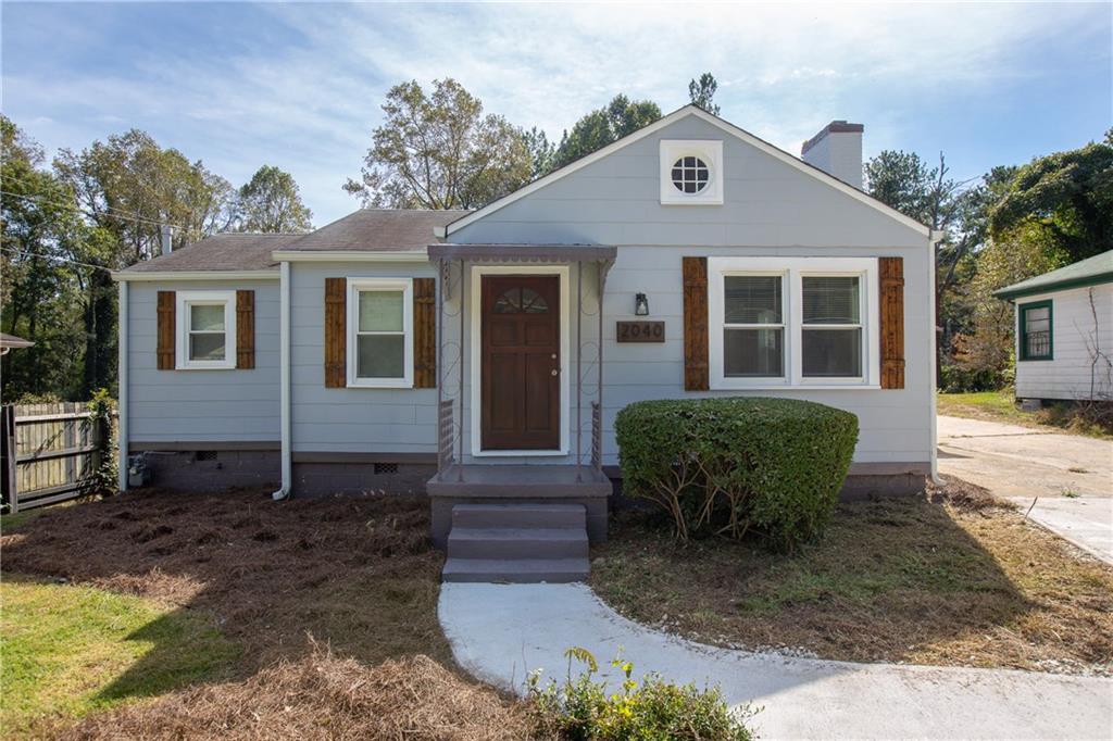 2040 Beecher Road Southwest Atlanta, GA 30311 - Photo 1 of 1 a front view of a house with garden