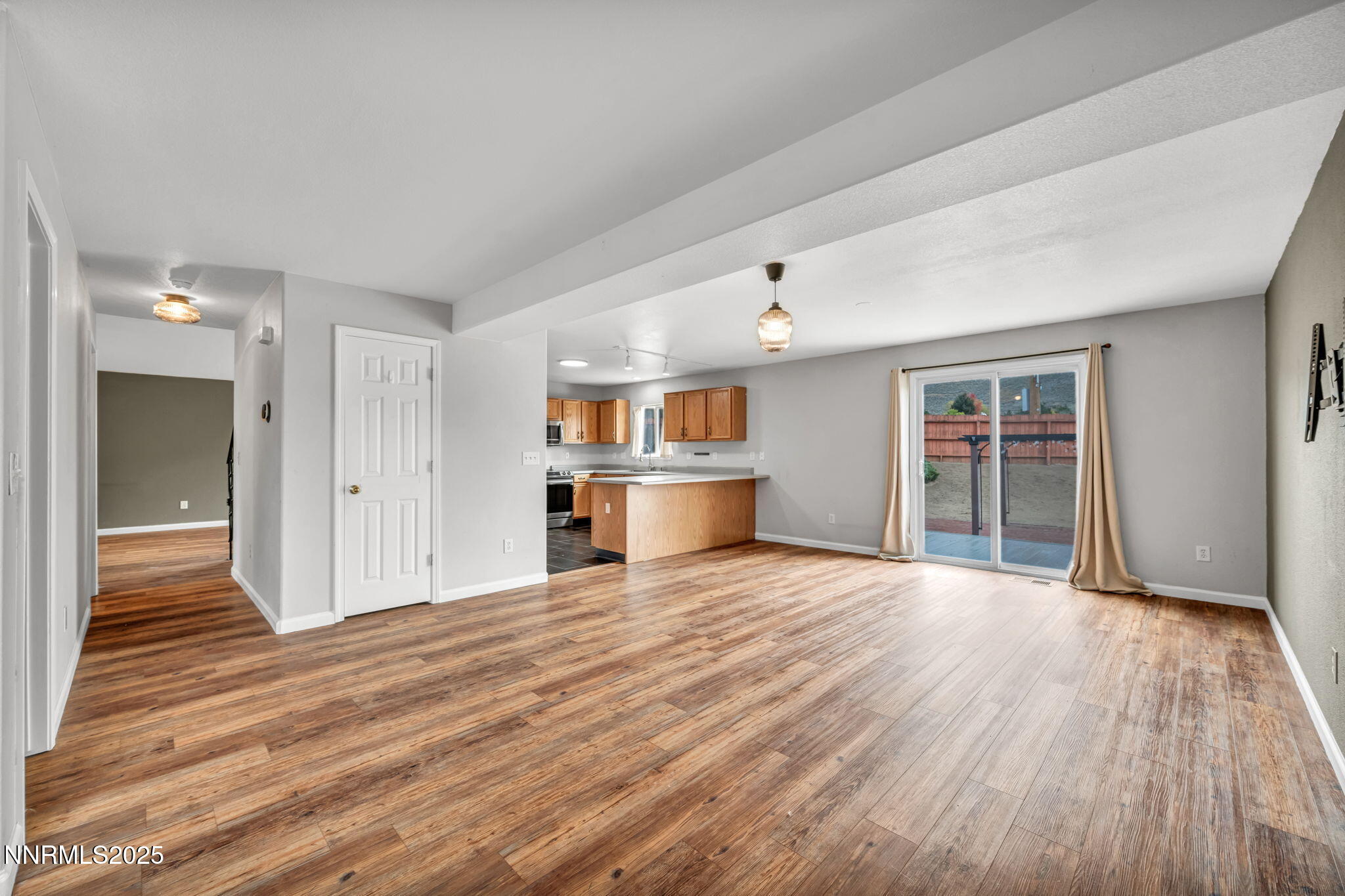 17702 Clear Springs Court Reno, NV 89508 - Photo 13 of 41 a view of a kitchen with wooden floor and a refrigerator