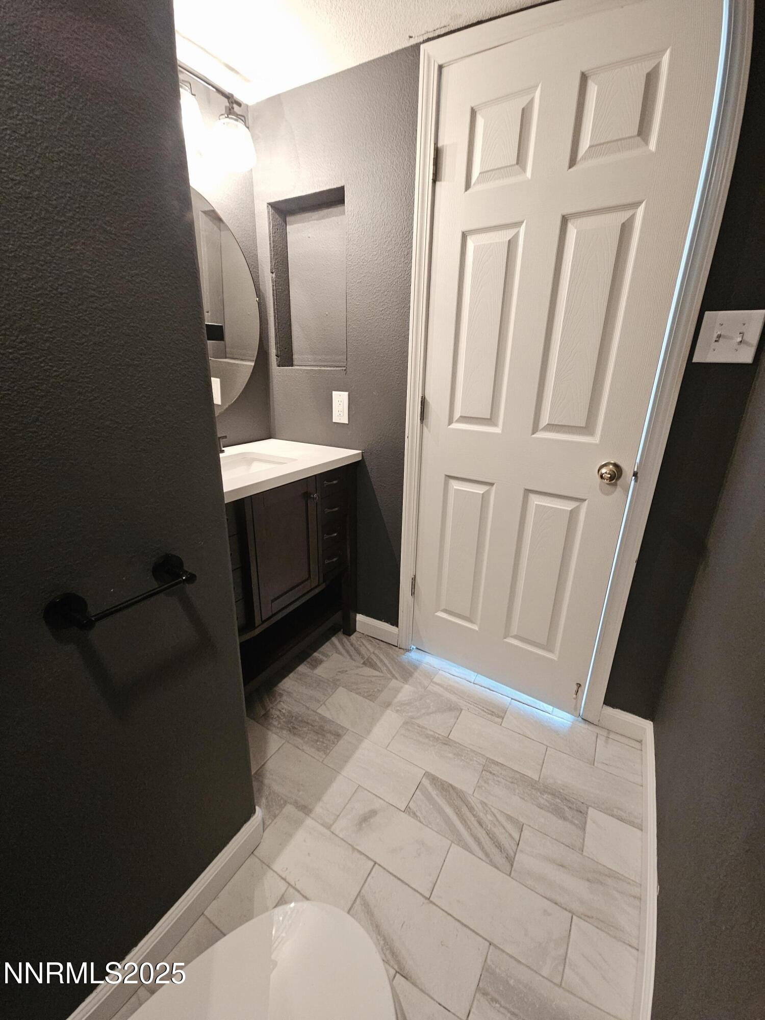 17702 Clear Springs Court Reno, NV 89508 - Photo 15 of 41 a bathroom with a sink and a mirror