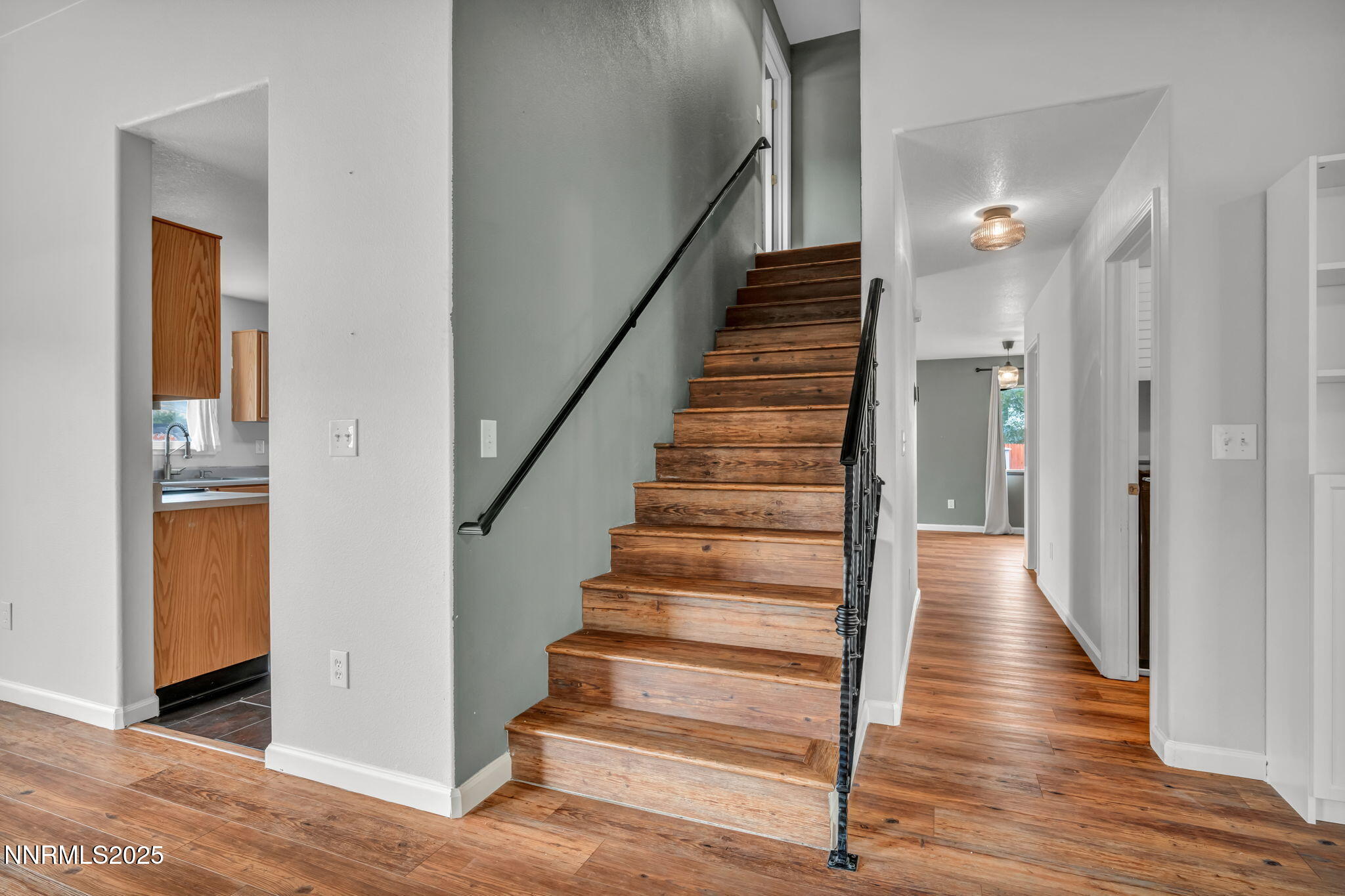 17702 Clear Springs Court Reno, NV 89508 - Photo 17 of 41 a view of a hallway with wooden floor and entryway