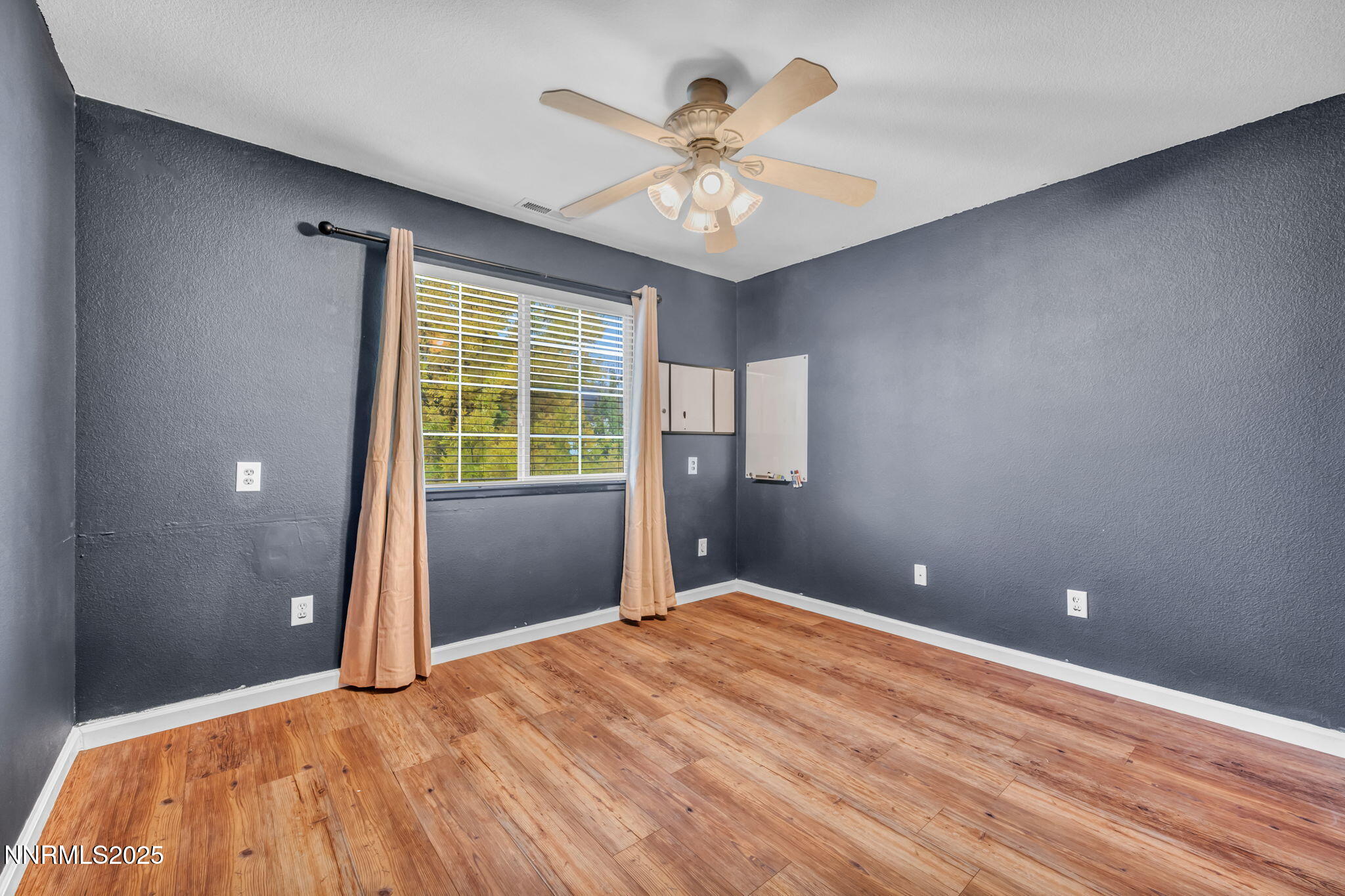 17702 Clear Springs Court Reno, NV 89508 - Photo 21 of 41 a view of an empty room with a window