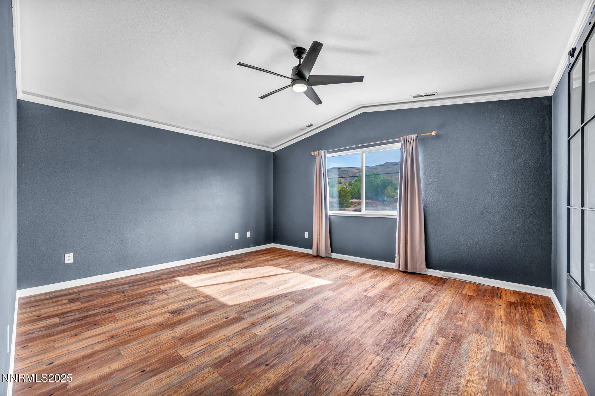 17702 Clear Springs Court Reno, NV 89508 - Photo 24 of 41 a view of an empty room with wooden floor and a window