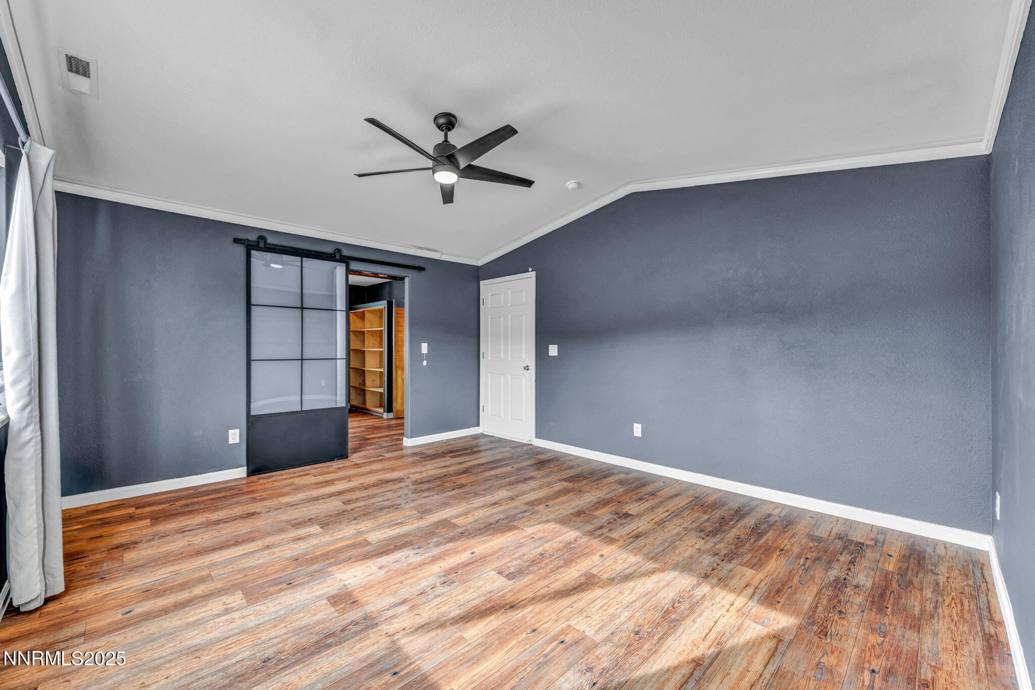 17702 Clear Springs Court Reno, NV 89508 - Photo 25 of 41 a view of empty room with wooden floor and fan