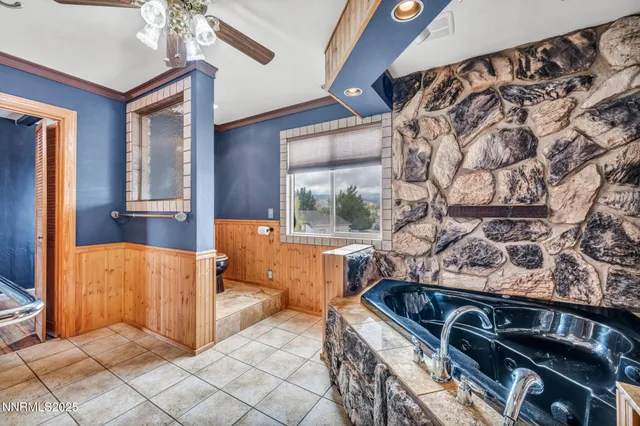 a kitchen with stainless steel appliances granite countertop a stove and cabinets