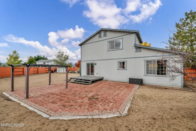 a view of a house with a yard and pathway