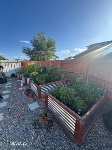 a view of a backyard with sitting area