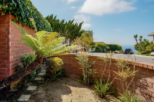 a view of balcony with wooden floor