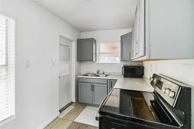 a kitchen with a stove and a refrigerator