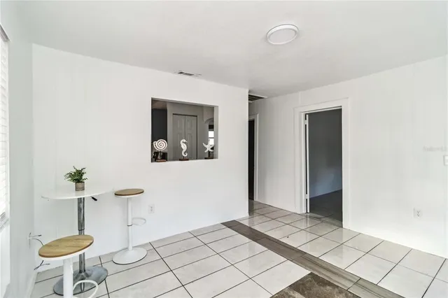 a view of an empty room and window