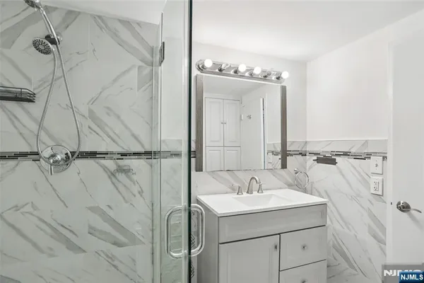 a bathroom with a sink and mirror