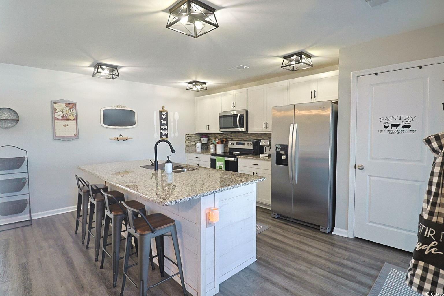 127 Clover Walk Drive Conway, SC 29526 - Photo 16 of 36 Kitchen featuring an island with sink, appliances