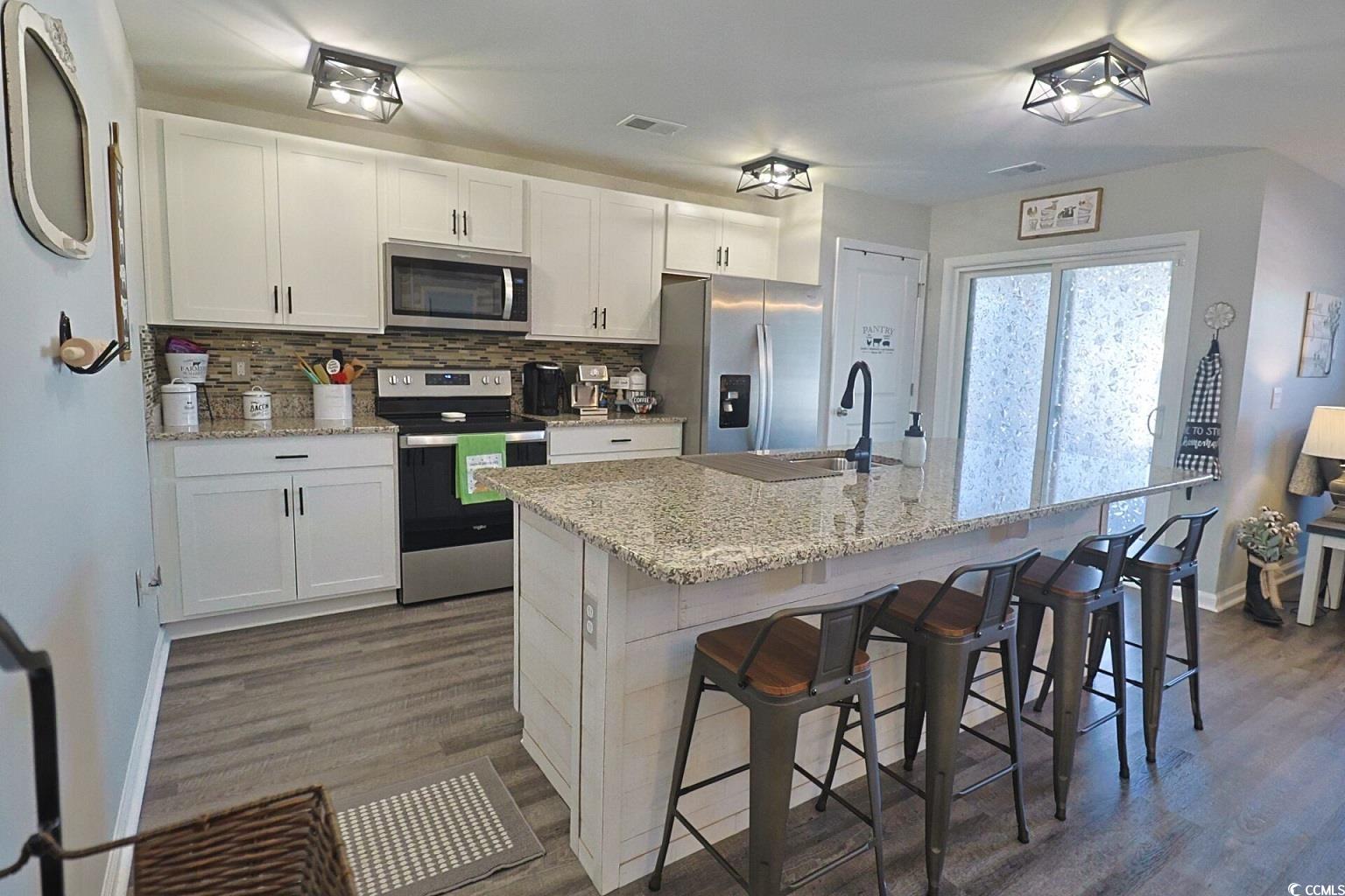 127 Clover Walk Drive Conway, SC 29526 - Photo 17 of 36 Kitchen featuring a breakfast bar, visible vents,