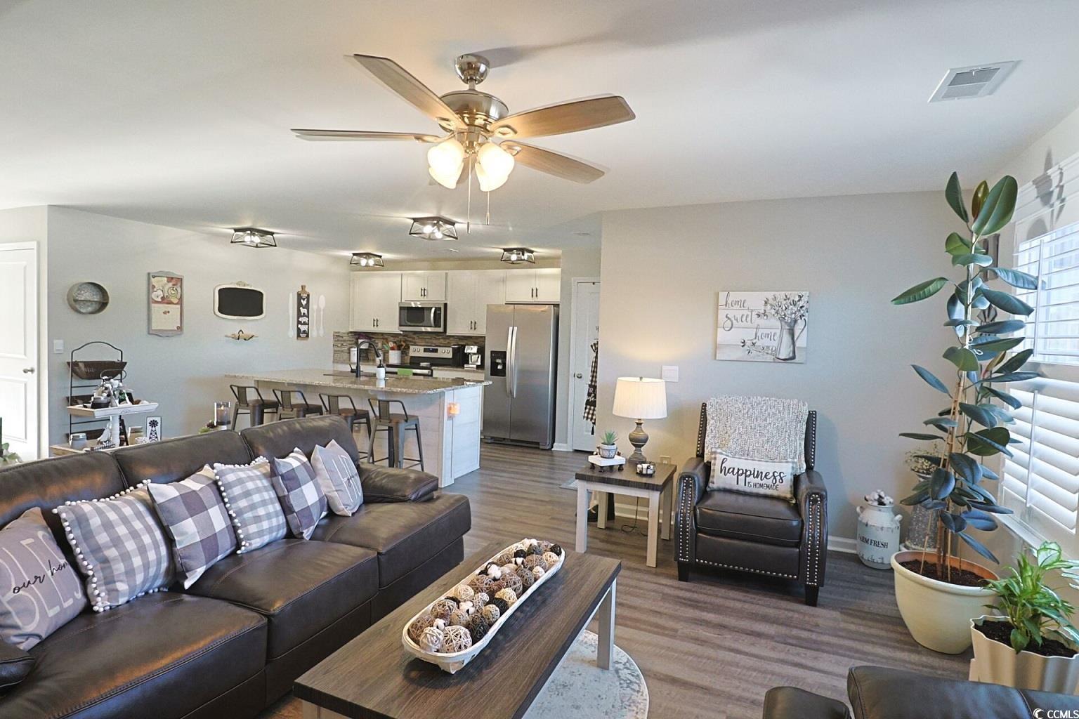 127 Clover Walk Drive Conway, SC 29526 - Photo 20 of 36 Living area featuring a ceiling fan, baseboards, v