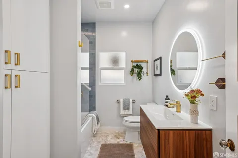 a bathroom with a sink and a shower