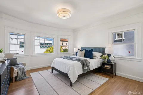 a bedroom with furniture and a window