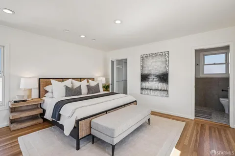 a bedroom with furniture and a window