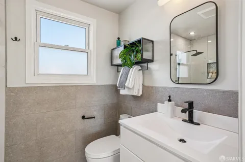 a bathroom with a shower and a sink