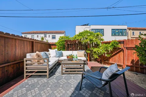 a backyard of a house with seating space