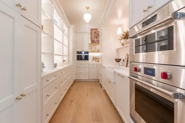 a kitchen with cabinets and white appliances