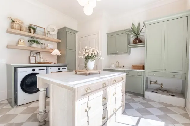 a living room with furniture a fireplace and a table