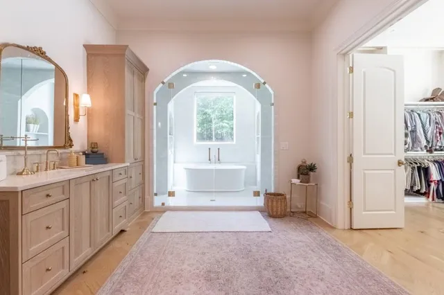 a bathroom with a double vanity sink mirror and shower