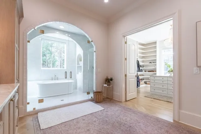 a white bath tub sitting next to a white sink