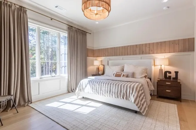 a bathroom with a double vanity sink toilet and shower