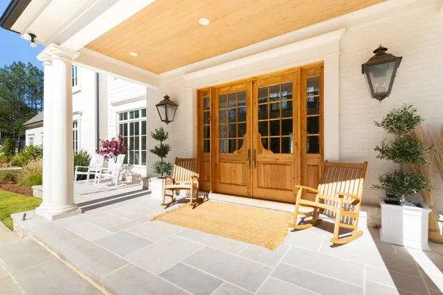 a view of a patio with a table and chairs