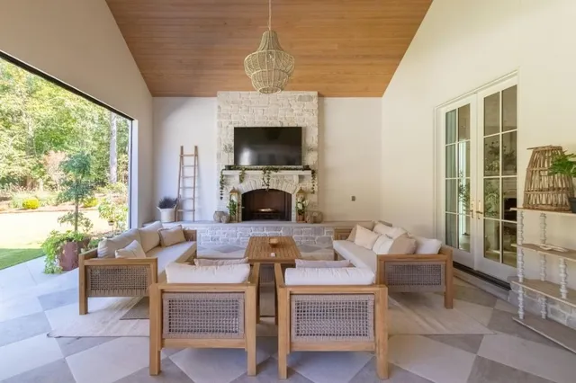 a living room with furniture and a potted plant