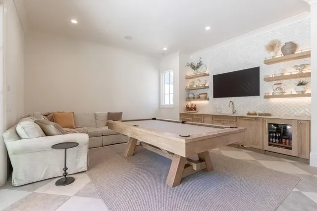 a view of a house with swimming pool and a yard