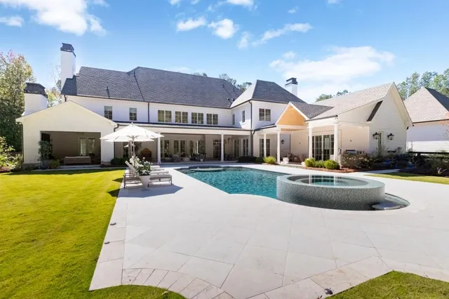 a view of a house with backyard porch and patio