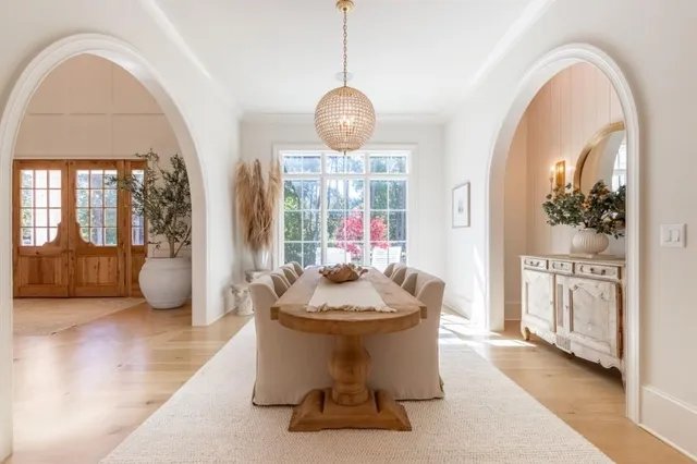 a dining room with furniture window and outdoor view