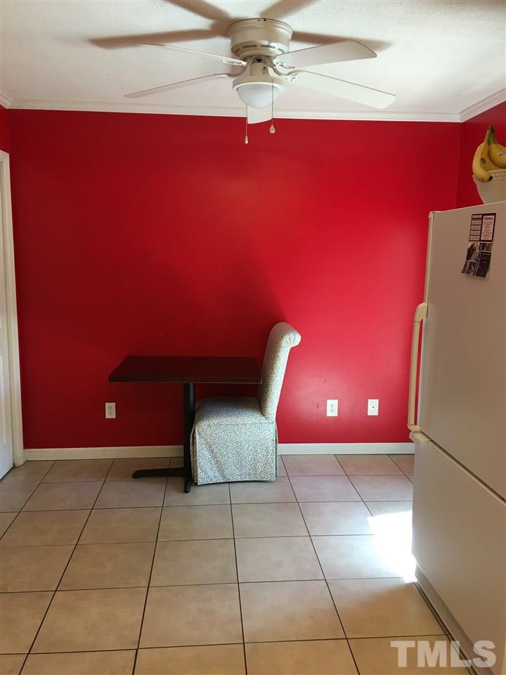 110 Rhum Place Garner, NC 27529 - Photo 11 of 21 Eat in Spacious Kitchen! Tile Floor overlooking back patio!