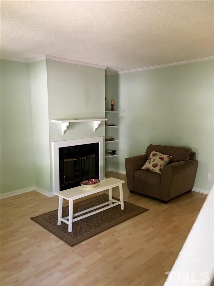 110 Rhum Place Garner, NC 27529 - Photo 5 of 21 Build in Bookshelves / Fireplace / Laminate Flooring