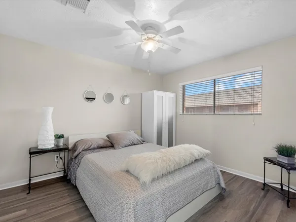 a bedroom with a bed and a table