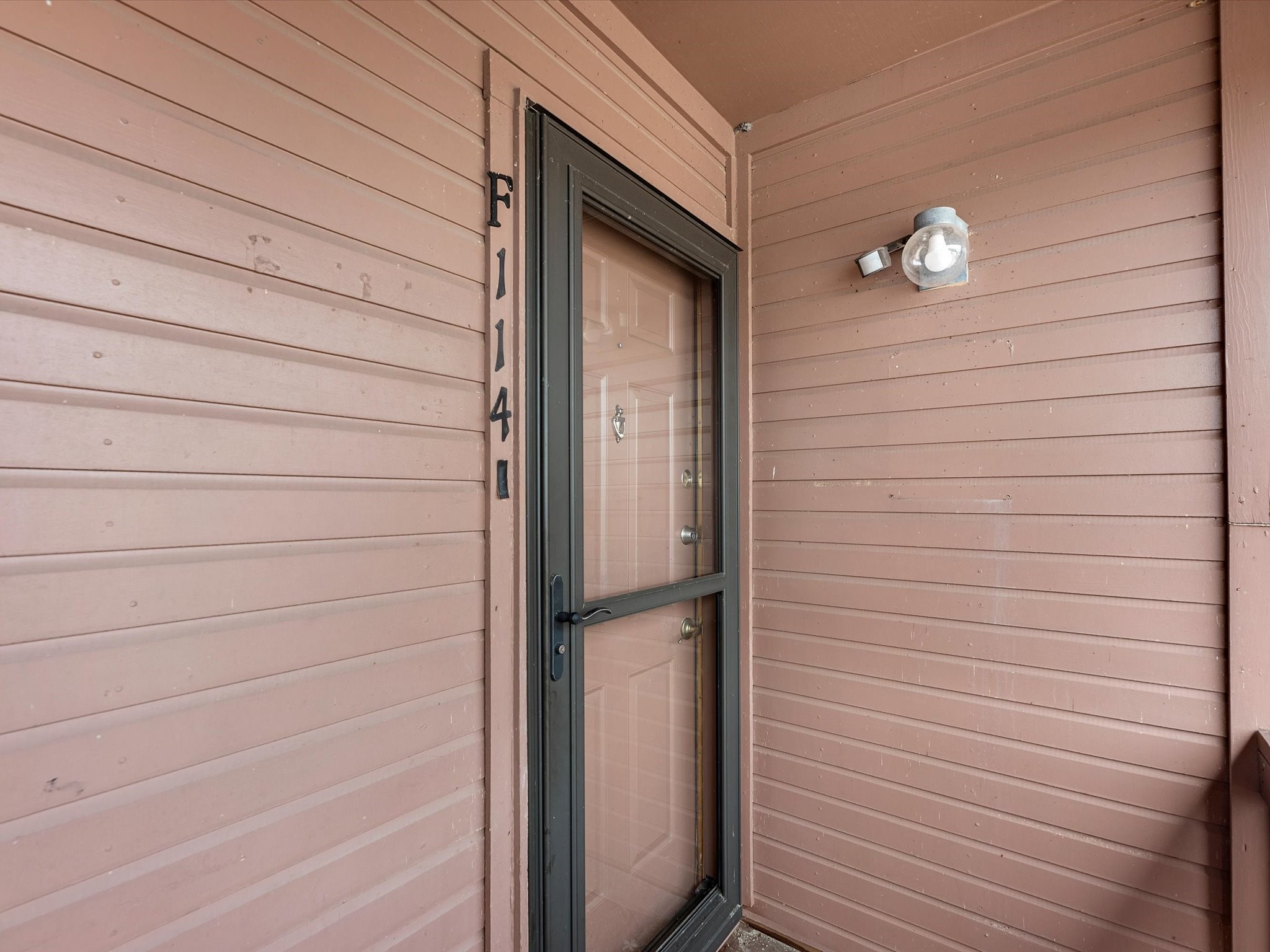 801 River Road, Unit 114F Montgomery, TX 77356 - Photo 2 of 25 a view of wooden door