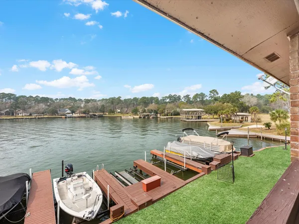 a view of a lake with couches and city view