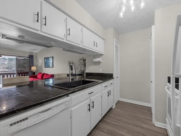 a kitchen with cabinets and appliances