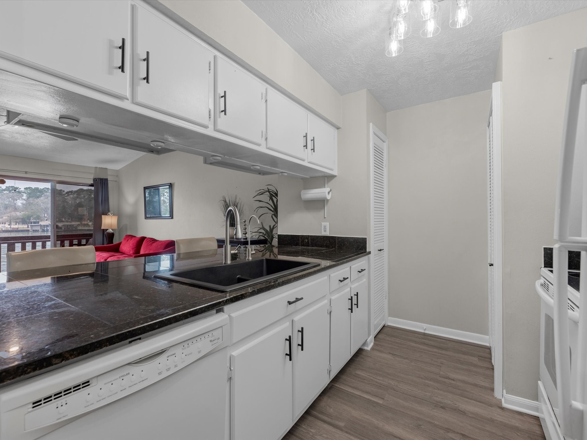 801 River Road, Unit 114F Montgomery, TX 77356 - Photo 8 of 25 a kitchen with cabinets and appliances