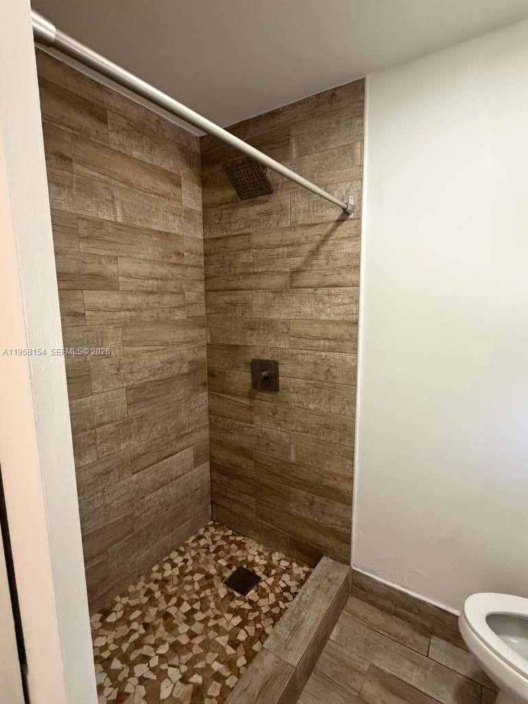5843 Harding Street, Unit 12 Hollywood, FL 33021 - Photo 3 of 6 a bathroom with a wooden floor