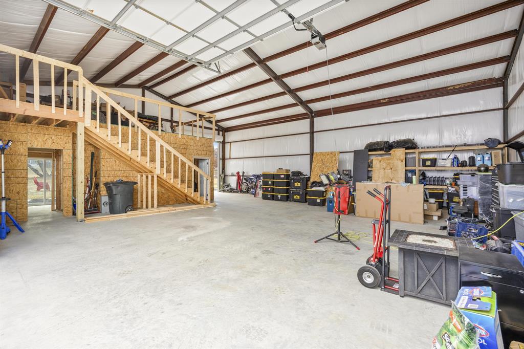 2024 Antler Loop Poolville, TX 76487 - Photo 34 of 40 Inside the shop, lots of storage!!