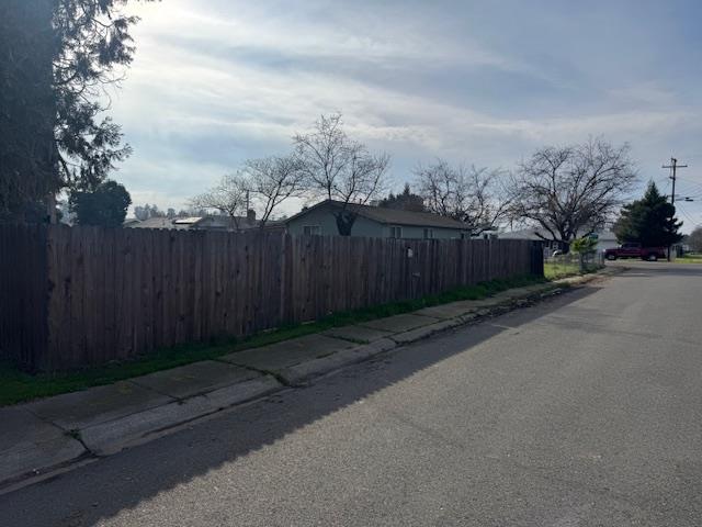 7315 Doc Adams Road Marysville, CA 95901 - Photo 3 of 3 a view of a street with wooden fence