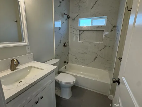 a kitchen with stainless steel appliances granite countertop a stove and a sink