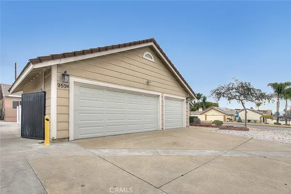 a view of garage with parked cars