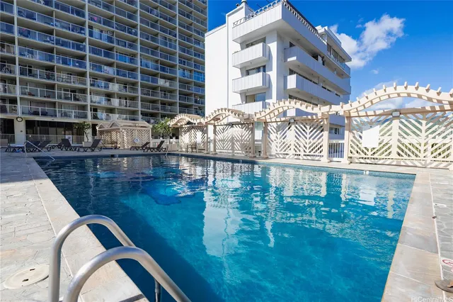 a close view of residential houses with outdoor space and swimming pool