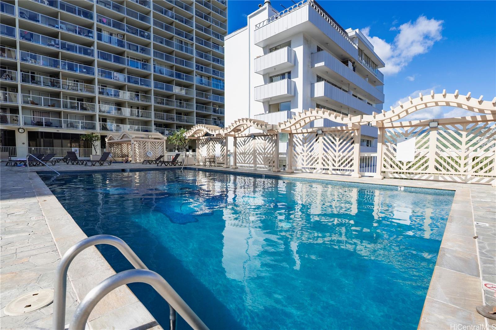 445 Seaside Avenue, Unit 2006 Honolulu, HI 96815 - Photo 12 of 23 a close view of residential houses with outdoor space and swimming pool